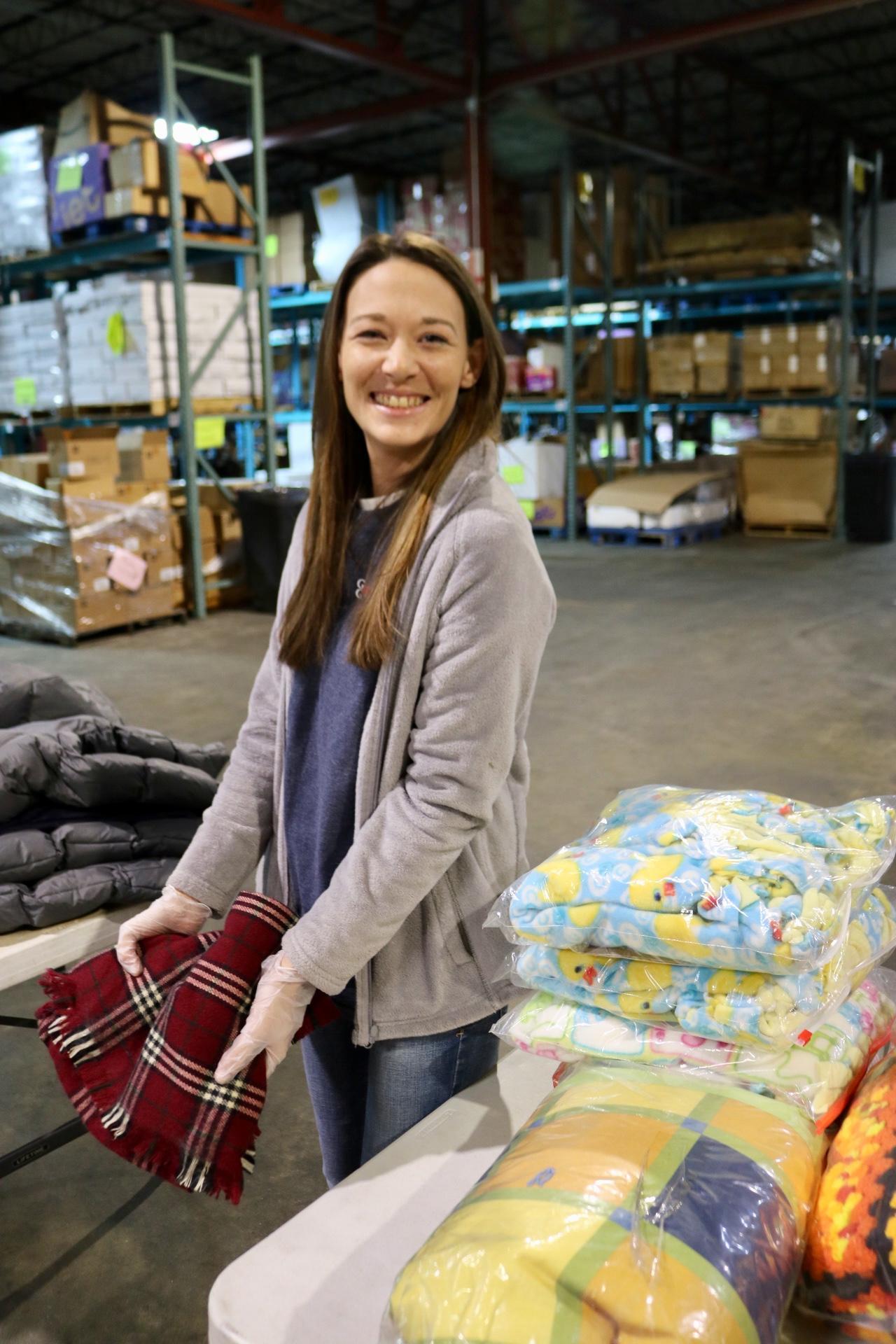 a woman standing in front of a store