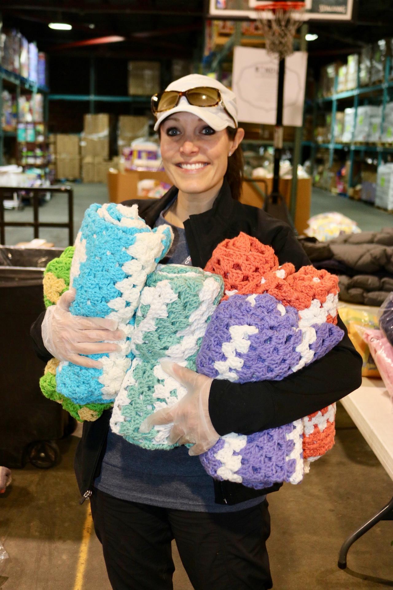 a woman holding a birthday cake