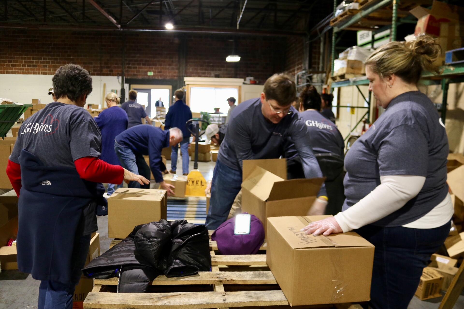 a group of people sitting in a box