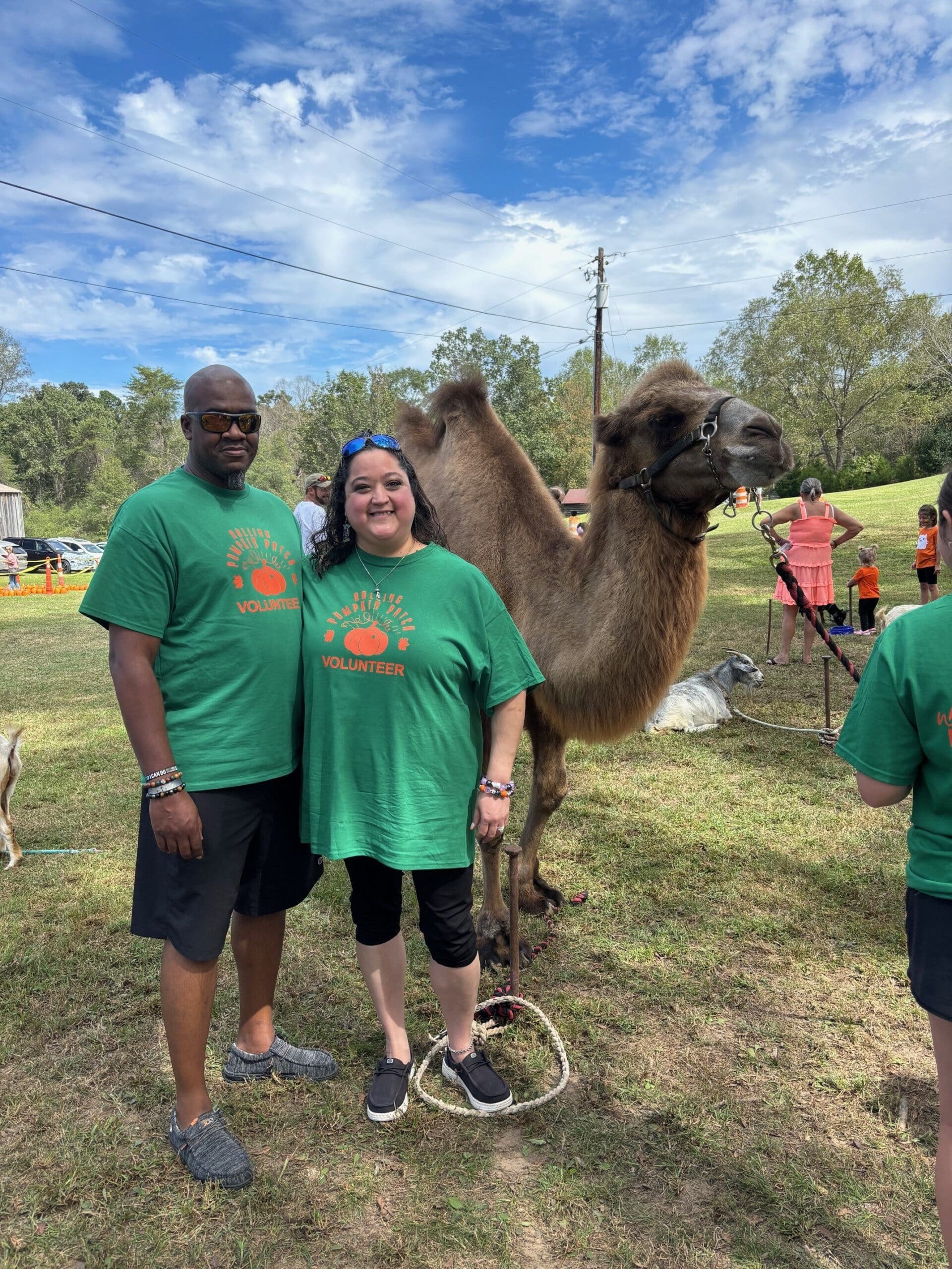 a group of people standing in the grass