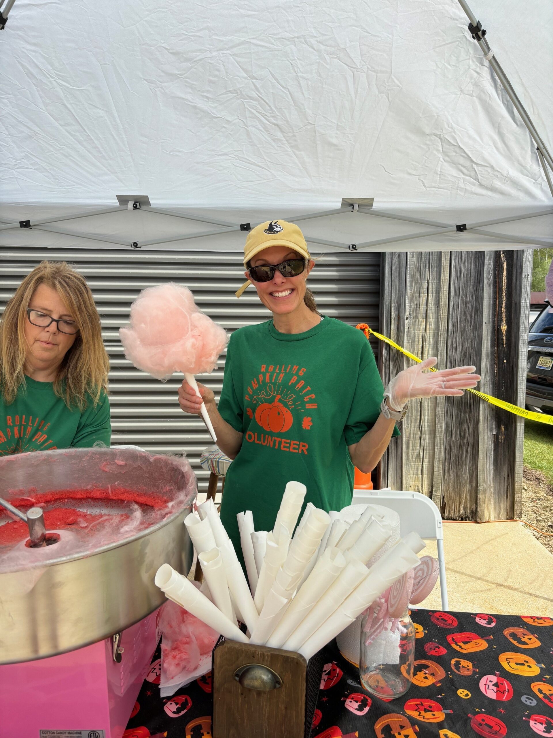 a person standing in front of a cake