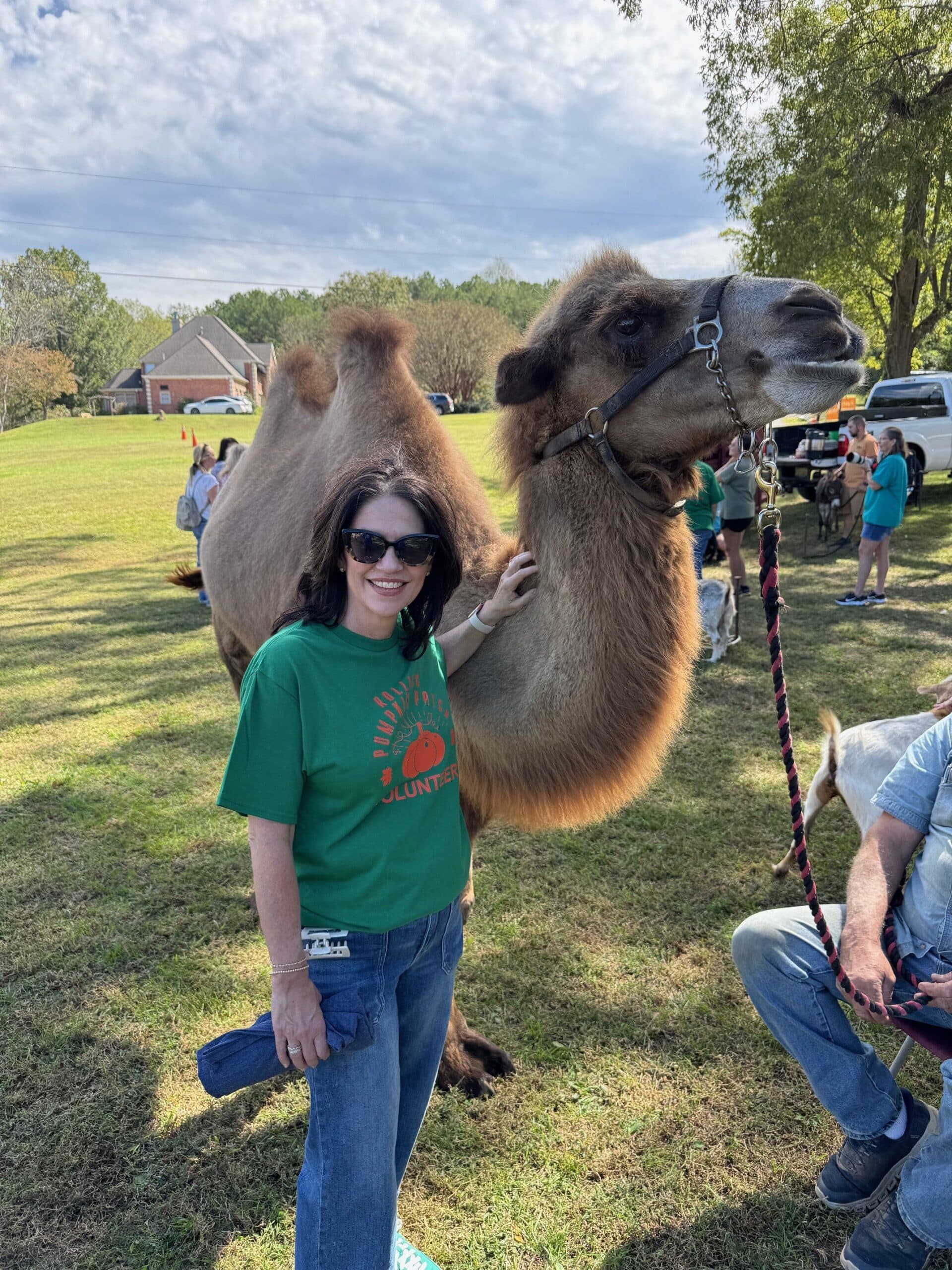 a group of people that are standing in the grass